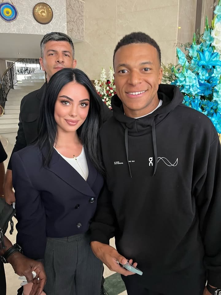 Kylian Mbappé with a fan