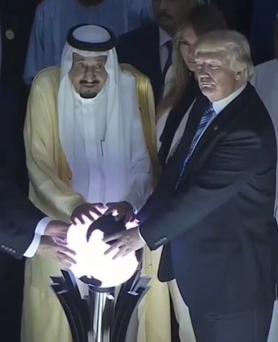 Trump and Saudi dignitary at ceremonial event Trump and Saudi dignitary at ceremonial event