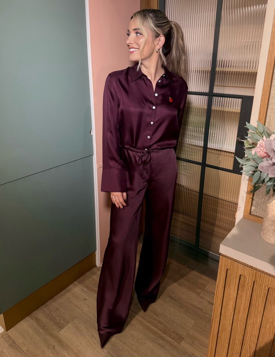 Sian Welby in burgundy pajamas (photo 2 of 3)