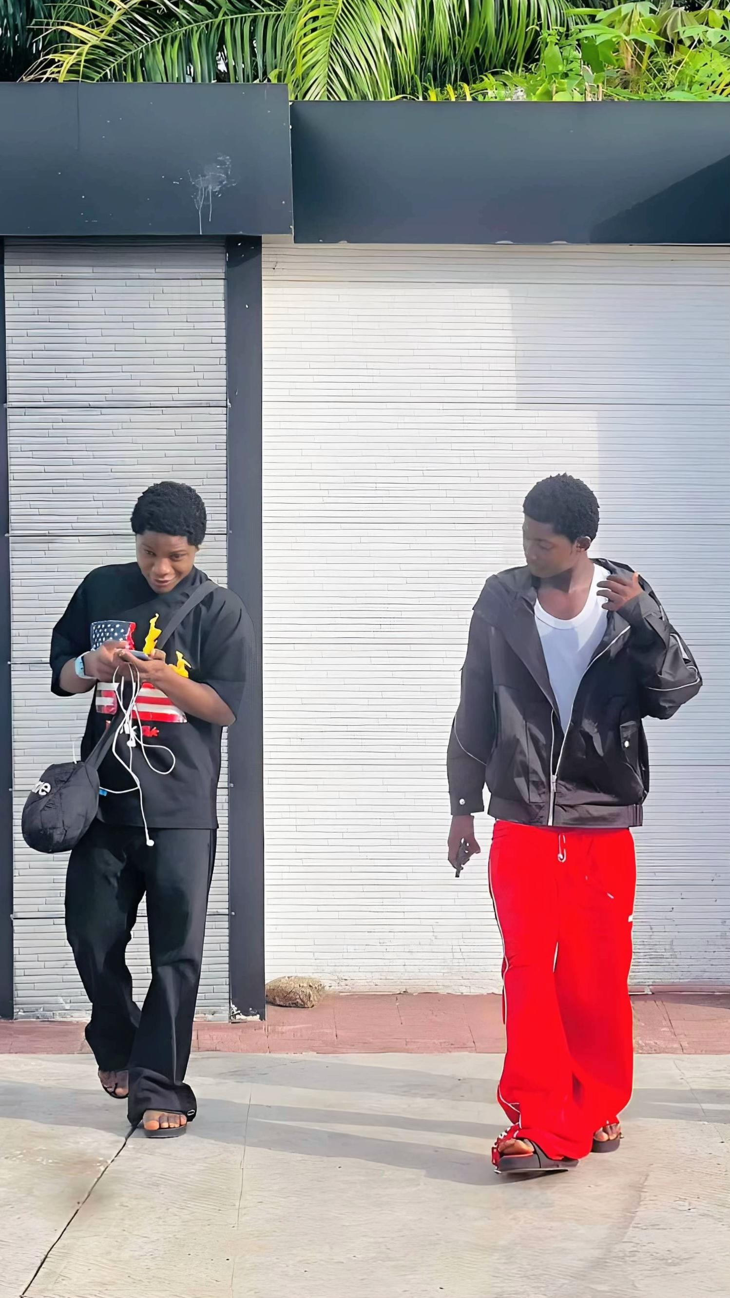 Young men walking outdoors (photo 3 of 4)