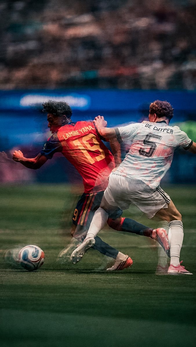 Lamine Yamal dribbling in red jersey