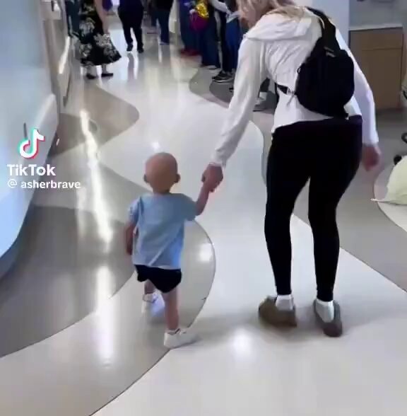 child leaving hospital cancer-free