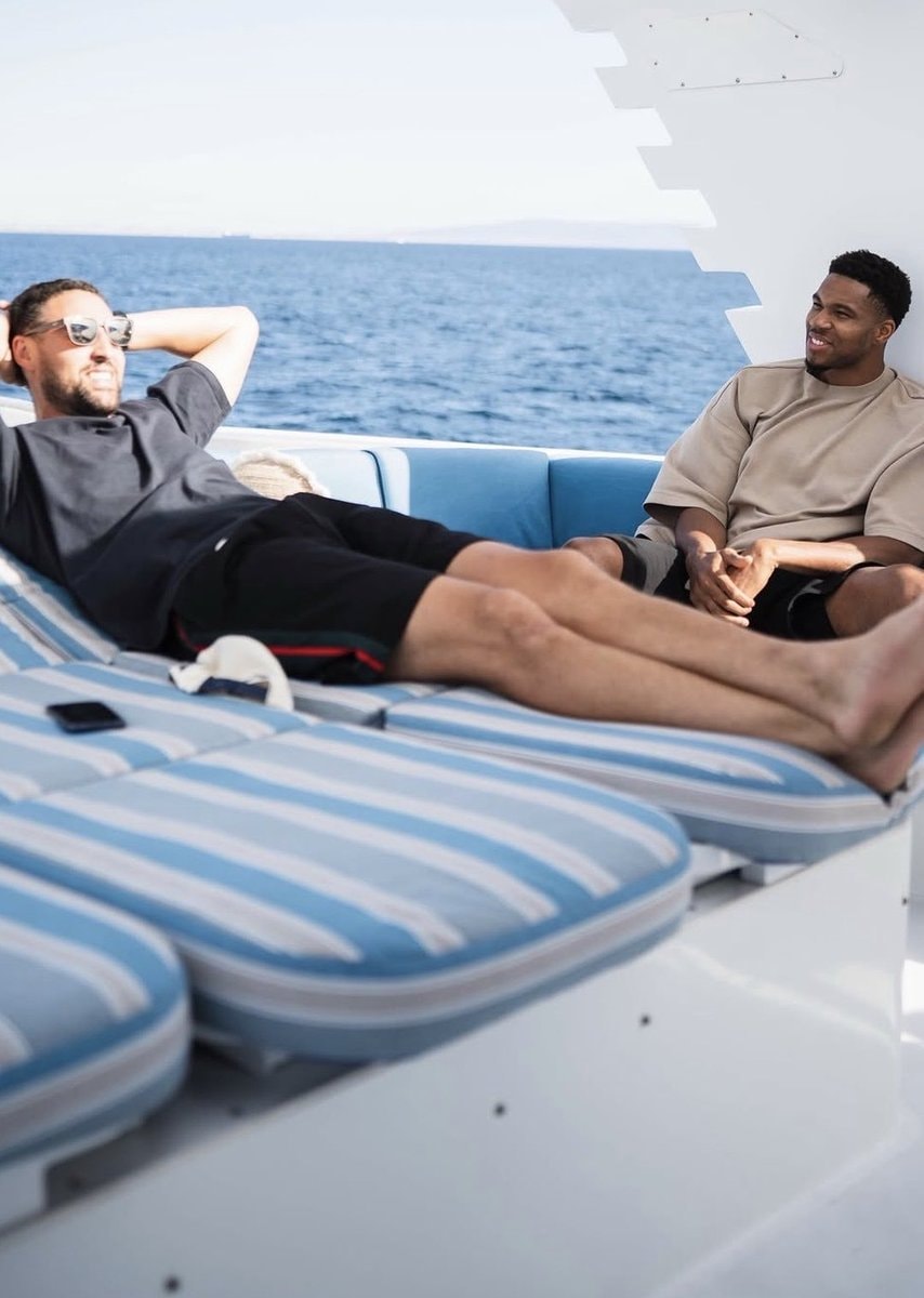 Giannis and Captain Klay on a yacht