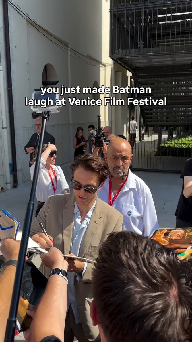 Robert Pattinson laughs at Venice Film Festival