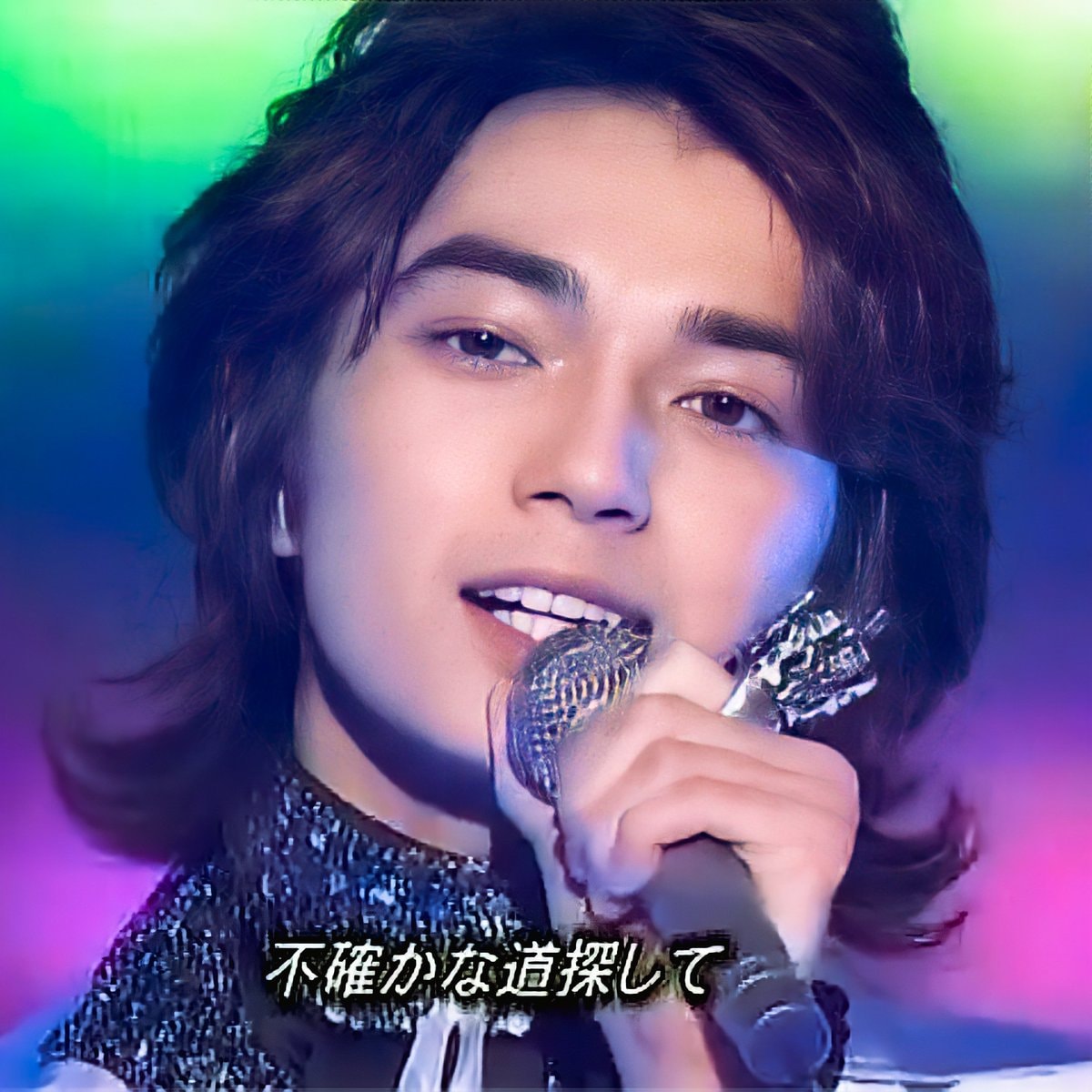 Young man singing with colorful lights (photo 4 of 4)