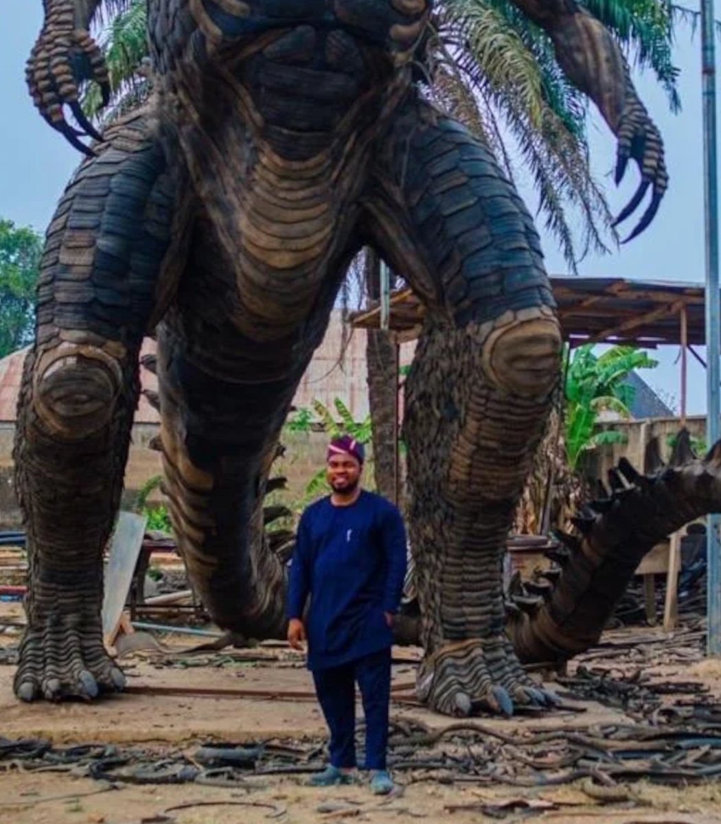 Toyeeb Ajayi Godzilla tire statue (photo 2 of 2)