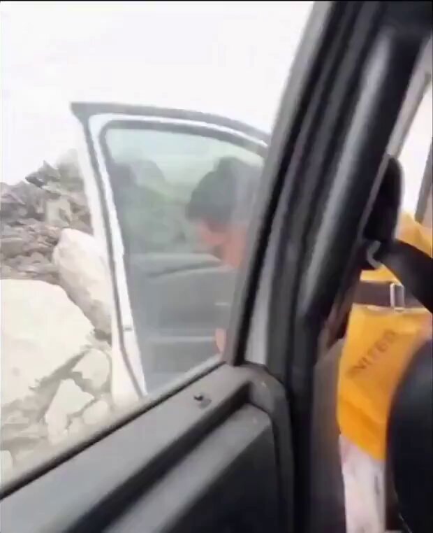 person exiting vehicle with UNITED seat