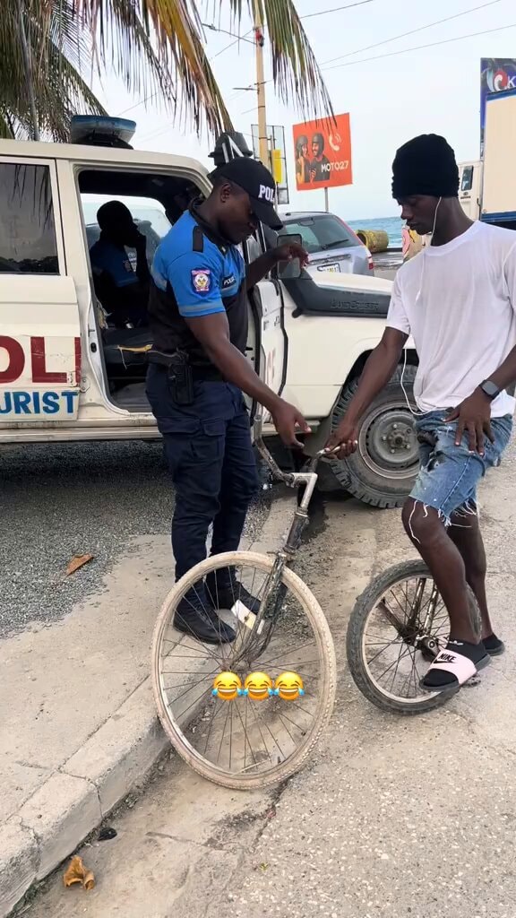 Police officer and young man on street