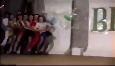 Tug of war scene with BE letters