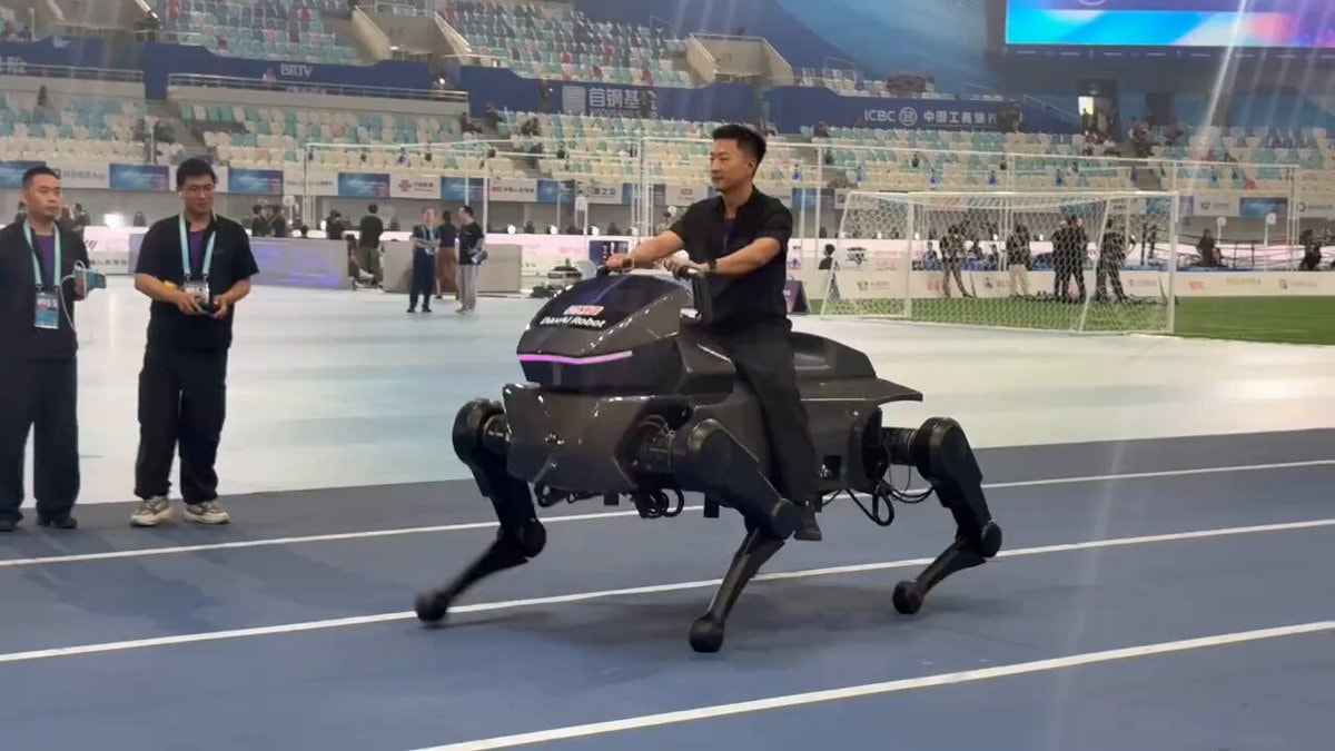 Man rides world's biggest robotic dog