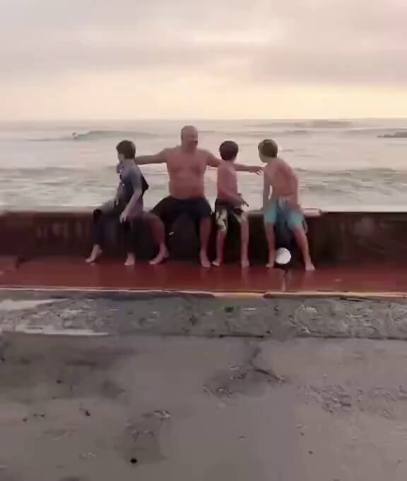 family ocean sunset moment