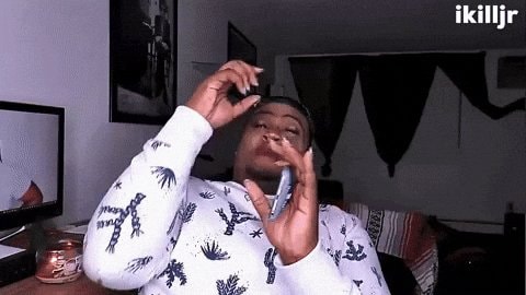 girl on phone adjusting hair GIF