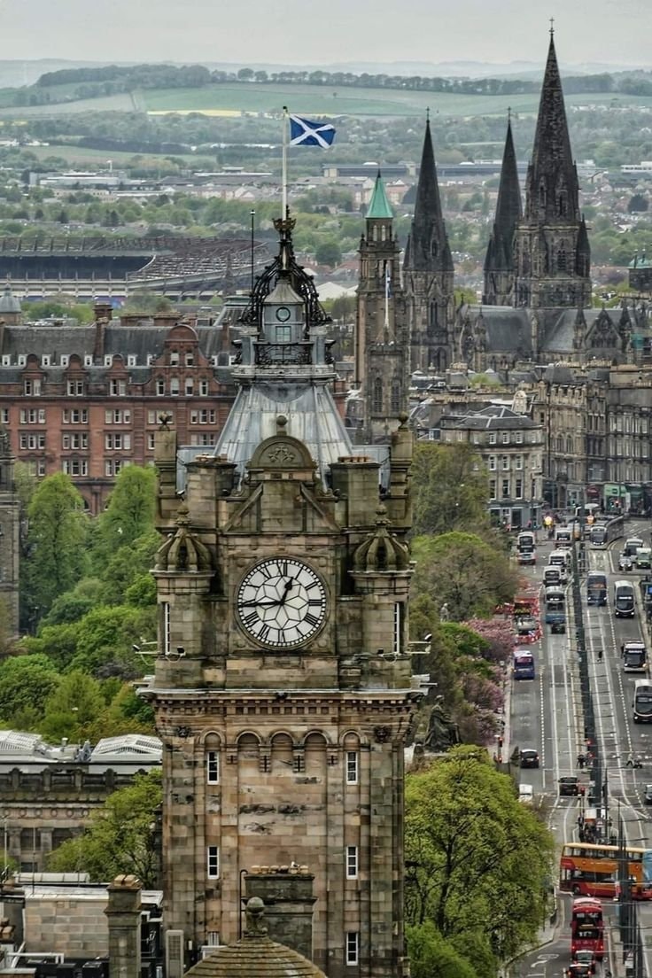 Edinburgh clock tower with Scottish flag