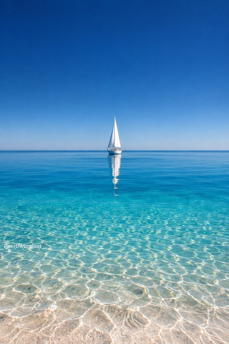 sailboat on turquoise water sailboat on turquoise water