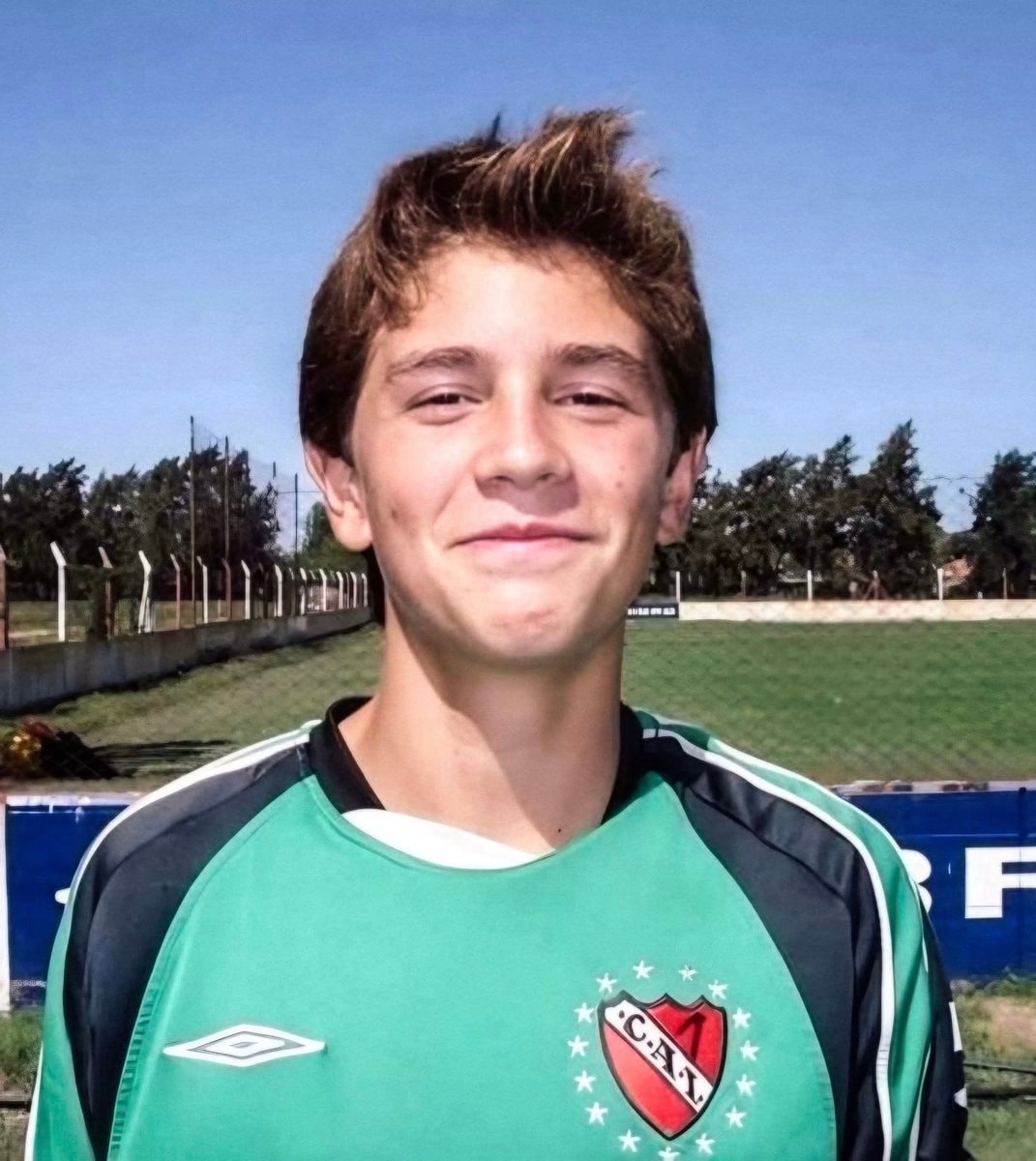 Young boy in green black soccer jersey Young boy in green black soccer jersey