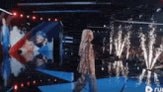 woman on stage with mic