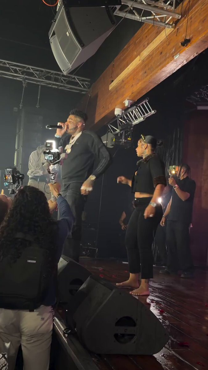 Chrisean Rock falls during Blueface performance