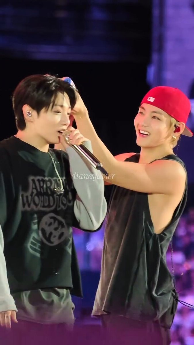 Taehyung watering Jungkook like a plant