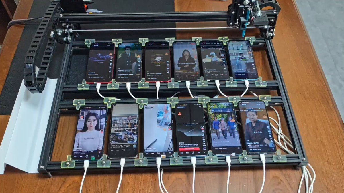 Robotic phone farm generating fake views