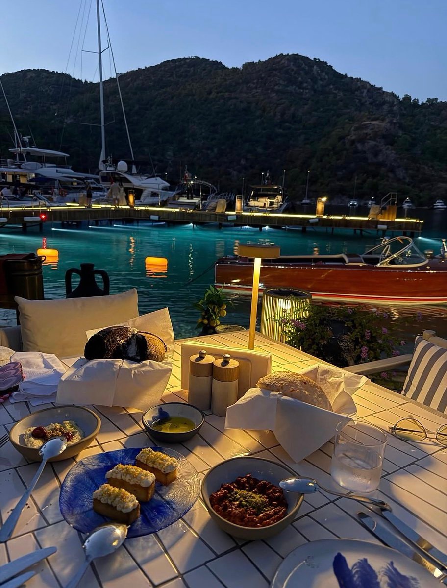 Serene Marina Dinner Setup at Dusk (photo 3 of 3)