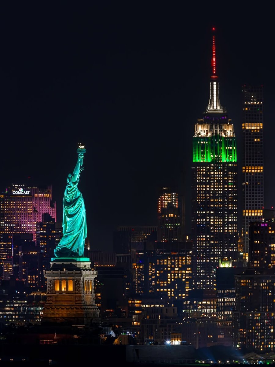 Statue of Liberty and Empire State Building at night