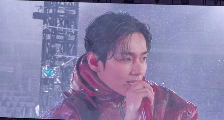 BTS performing in the rain during their tour (photo 2 of 4)