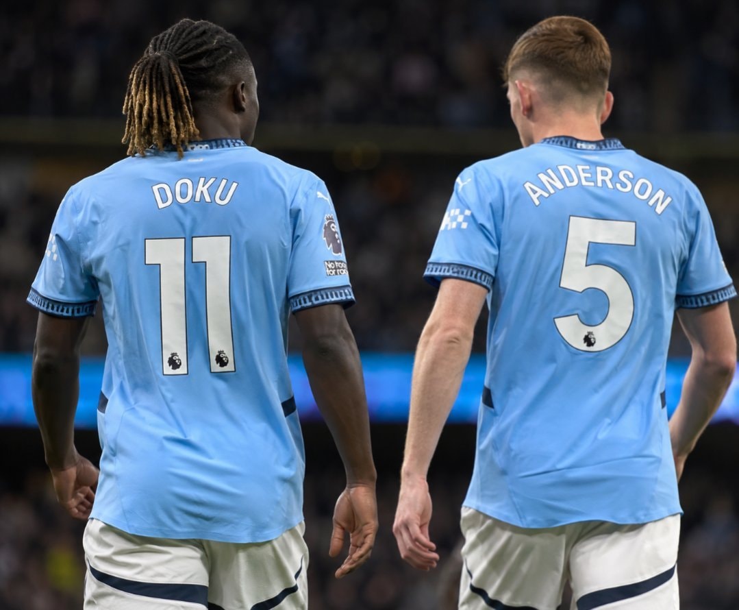 soccer players in light blue jerseys