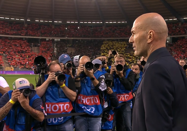bald man in suit aura