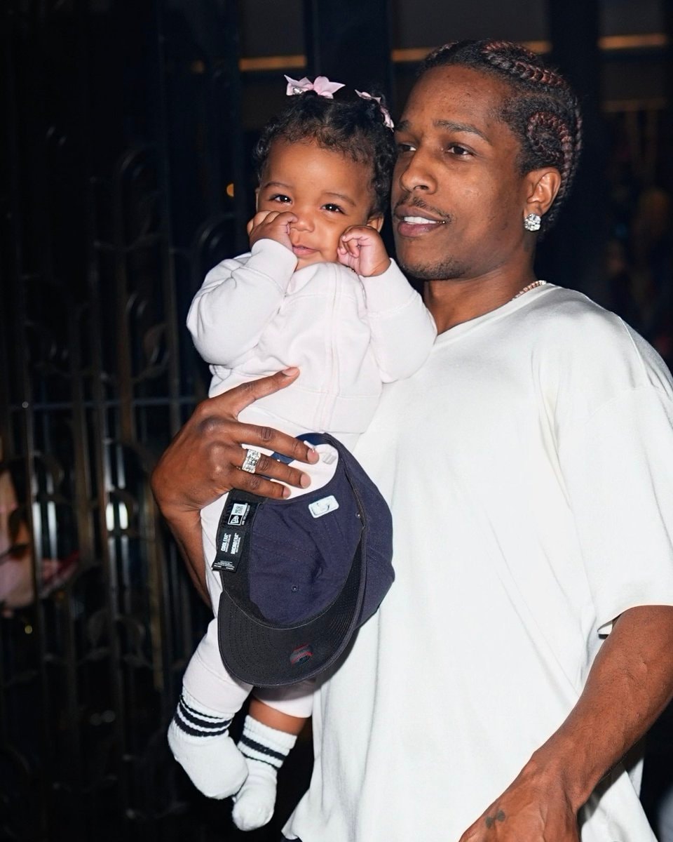 Rihanna holding baby Rocki