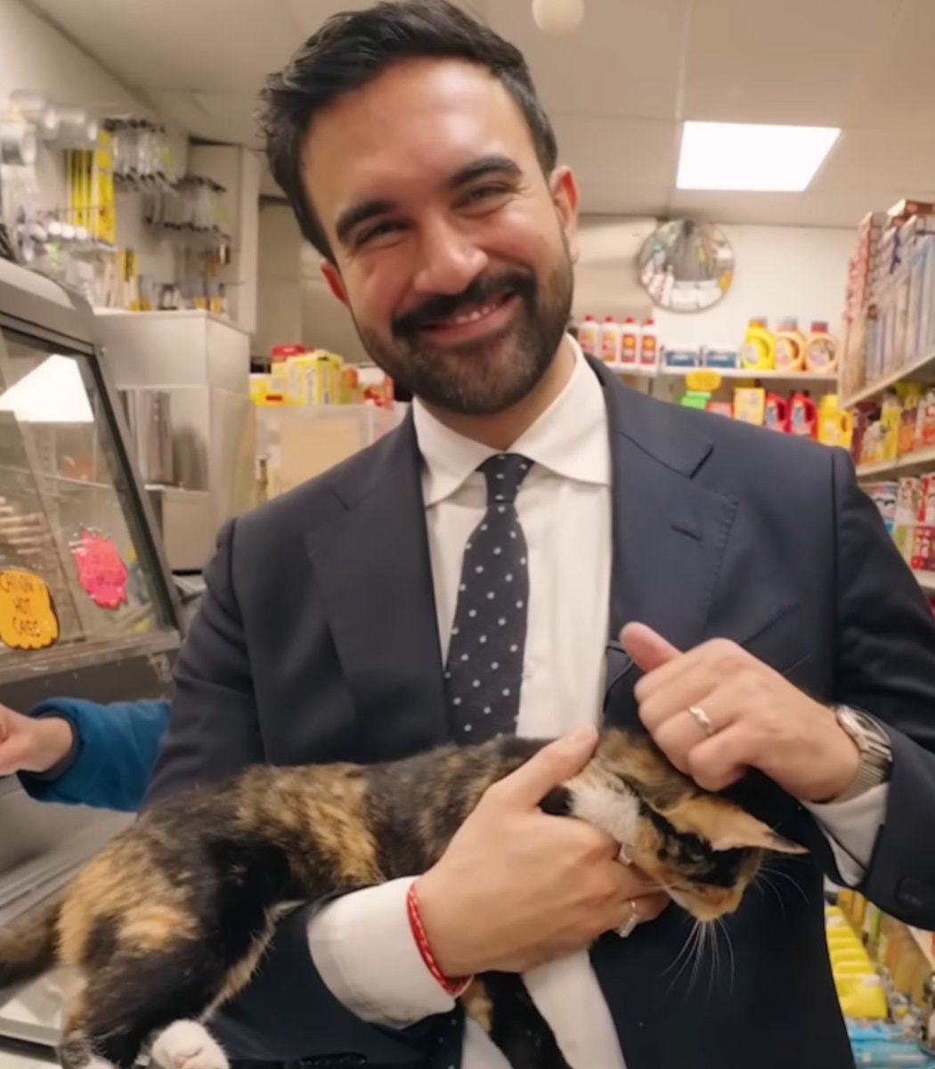Mamdani with cat in NYC pantry