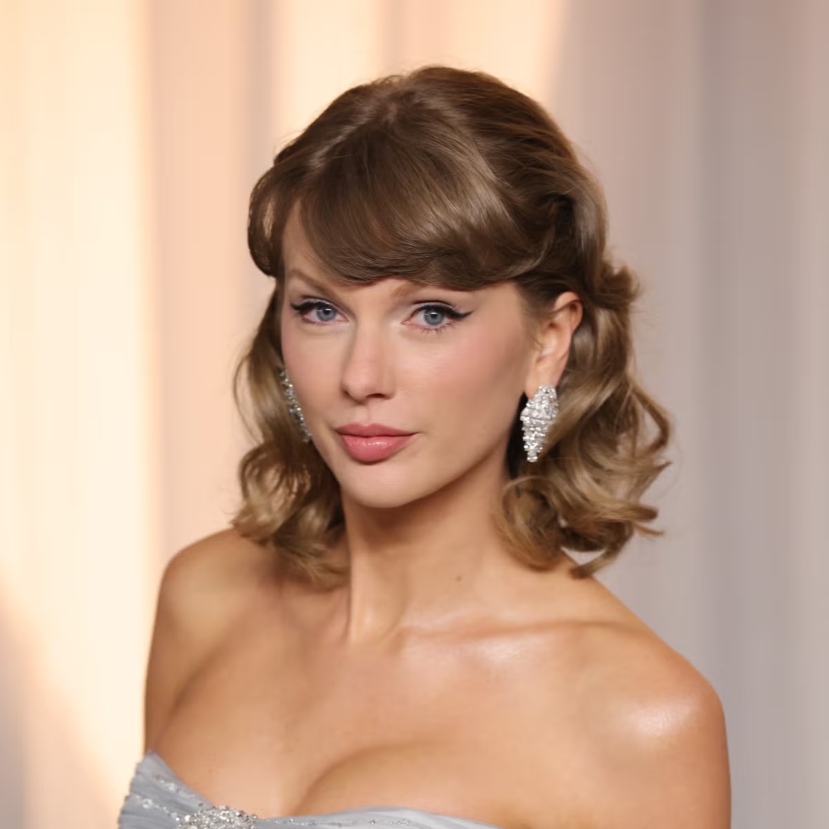 Taylor Swift Arrives at the Academy Museum Gala Wearing an Ice Blue Gown With a Giant Crystal Bow