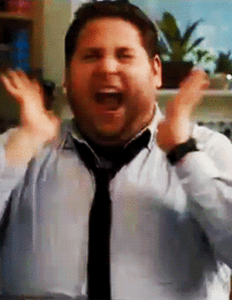 man yelling with hands up